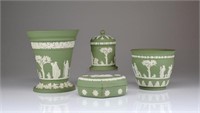 Four pieces of Wedgwood green jasperware