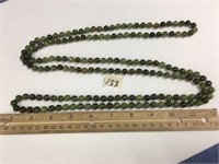 Green stone bead necklace, 64"        (a 7)