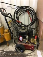 A Generac 2700 PSI pressure washer, with hose and