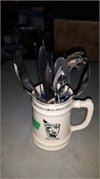 STEIN WITH CUTLERY