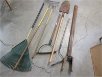mess of yard tools (hole digger-shovel-etc)
