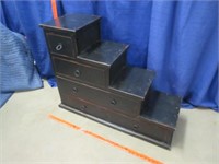 black distressed "step-style" cabinet