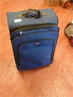 Large blue rolling suitcase