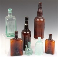 7 EARLY 20TH C. GLASS BOTTLES