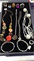 Group lot of costume jewelry including four