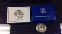 Two 1986 US liberty half dollars one in the