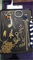 Tray lot of costume jewelry including gold tone