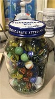 Jar of marbles including some shooters