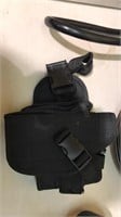 Hand gun holster with the straps
