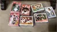 Six plastic boxes full of football cards