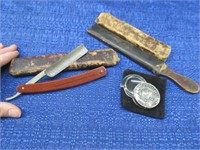 old straight razor-leather strop-magnifying glass