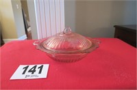 Pink Depression glass covered bowl.