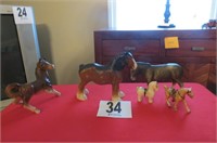 4 Ceramic horses, 1 plastic Donkey.