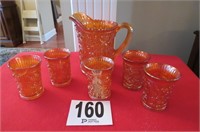 Old amber color pitcher and 5 glasses, 2 glasses