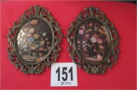 2 oval flower prints, metal frames.