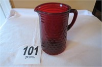Very old ruby colored pitcher, has a chip and