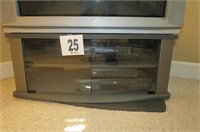 TV stand with glass doors.