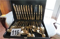 12 place setting Davo gold look flatware.