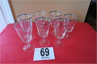 7 silver rimmed stemware glasses.