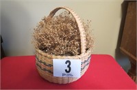 Basket with dried flowers. Has E.S. July 87 on