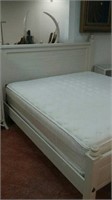 White wooden king size bed frame