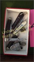 Box of vintage pocket knives, a thimble, and an
