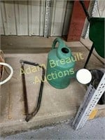 Metal bow saw, plastic watering can