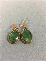 Pair of boulder faceted cut emerald earrings in si