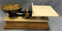 Vintage scale with marble bottom mounted on a wood