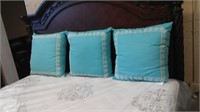 Three Blue Accent Pillows