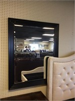 Black framed hanging mirror