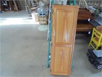 Wood cabinet with hide away ironing board