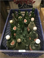 7-up bottles in plastic tote