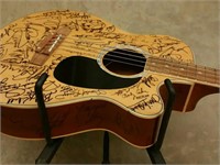 Signed acoustic bass guitar with certificate of