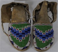 PAIR OF BEADED MOCCASINS ON HIDE, 10" HARD SOLES,