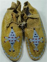 PAIR OF BEADED HIDE MOCCASINS WITH TURTLE FETISH