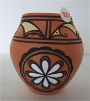 Zuni pottery featuring heart and deer design