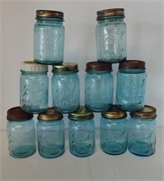 (11) Antique blue Ball jars with lids. Tallest
