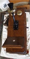 Antique phone with oak case and dovetail corners.