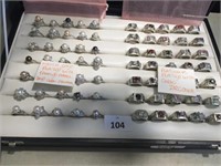 70 ASSORTED RINGS IN DISPLAY CASE