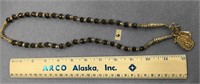 Approx. 28" jade bead necklace with religious meda