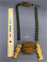 Approx. 24" jade necklace with oriental design pen