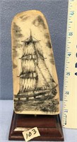 6" Scrimshawed ivory sailing ship on fossilized iv