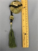 Chinese jade pendant on a silk cord          (k 15