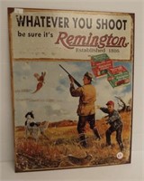 Metal Remington "Whatever you Shoot" sign.