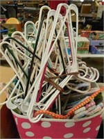 MANY HANGERS IN A POLKA DOT TUB-SOME HANGERS ARE