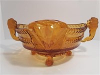 AMBER GLASS CLAW FOOT BOWL WITH LION HANDLES
