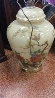 Pair of ceramic floral lamps with brown shades