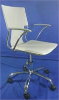 White leather office chair on wheels