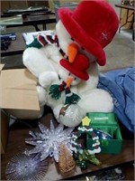 Christmas decorations and large stuffed snowman